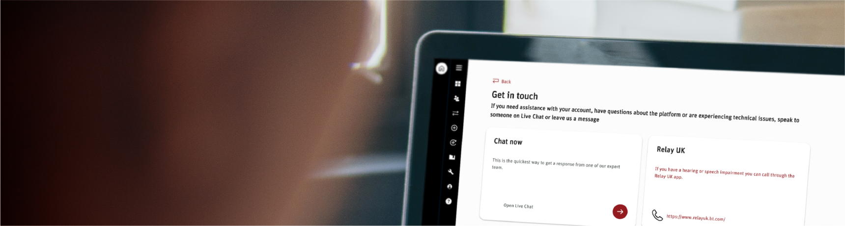 Close-up of a laptop screen showing the Scottish Widows Platform chat facility section of the website looked upon by a blurred female adviser on the left hand side