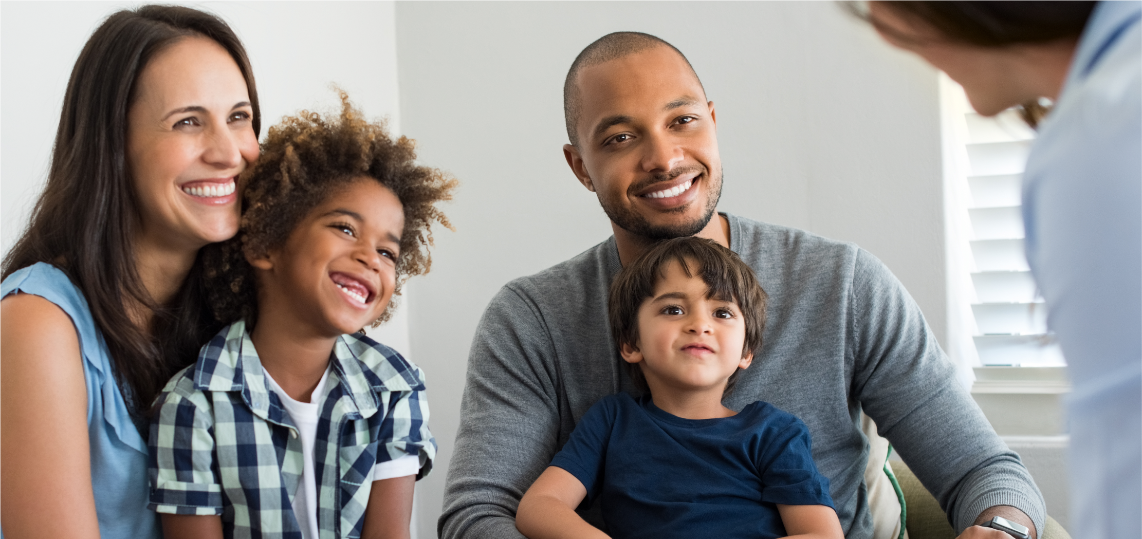 Happy family parents with two children.