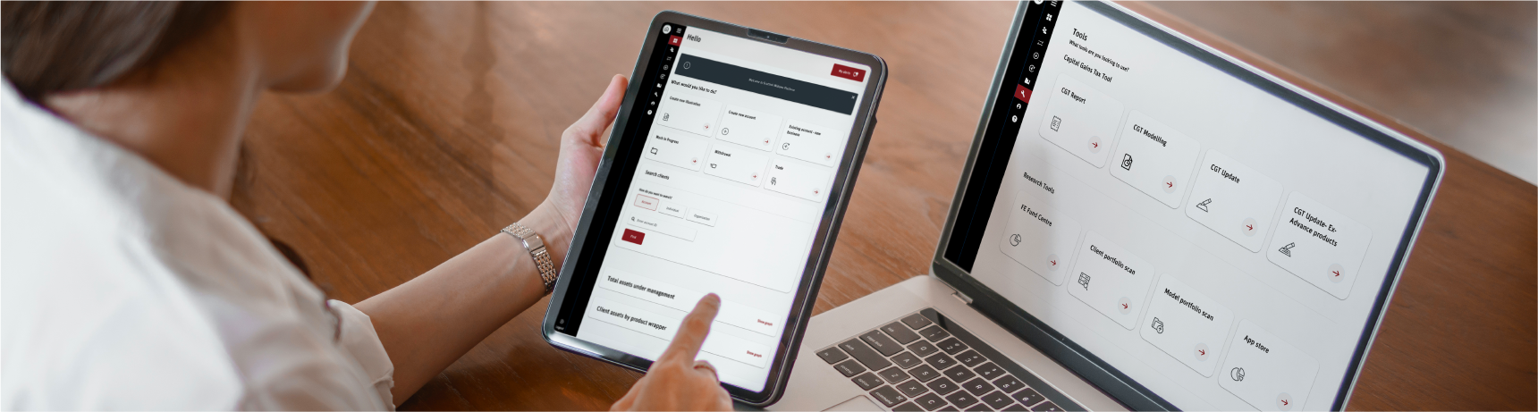 Female adviser working on the Scottish Widows Platform on a tablet device and laptop