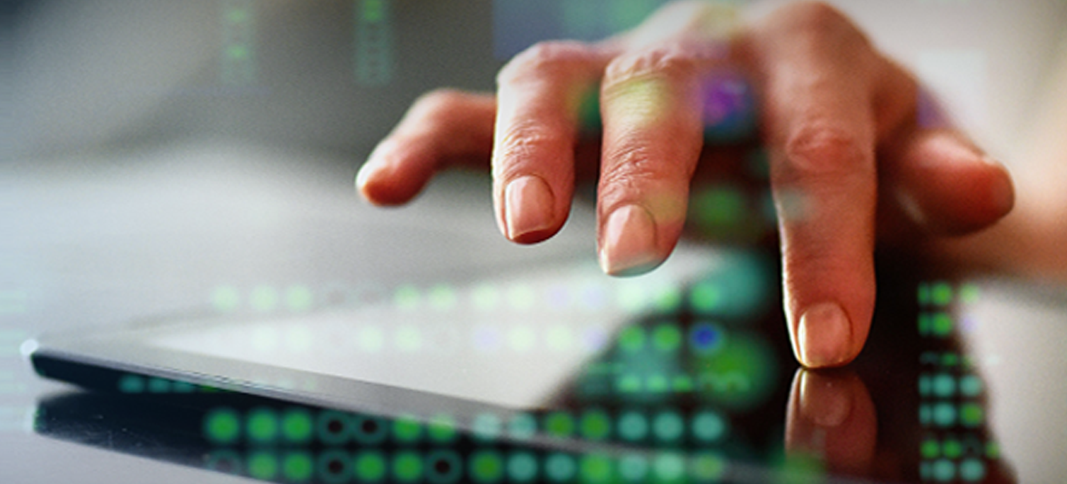 woman scrolling through a tablet.